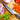 Global Classic 5 Inch Cooks Fluted Knife Lifestyle Image 3 shows a high-quality kitchen essential that combines style, durability, and superior cutting ability.